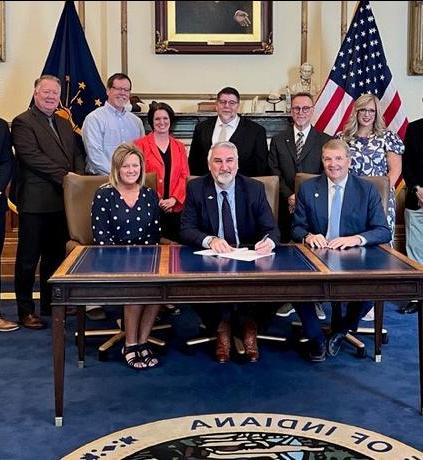 Gov. Eric Holcomb is signing a bill into law.