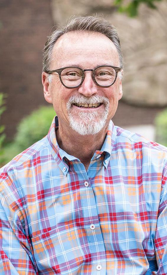 Portrait of Wylie Sirk in front of Neff Hall.